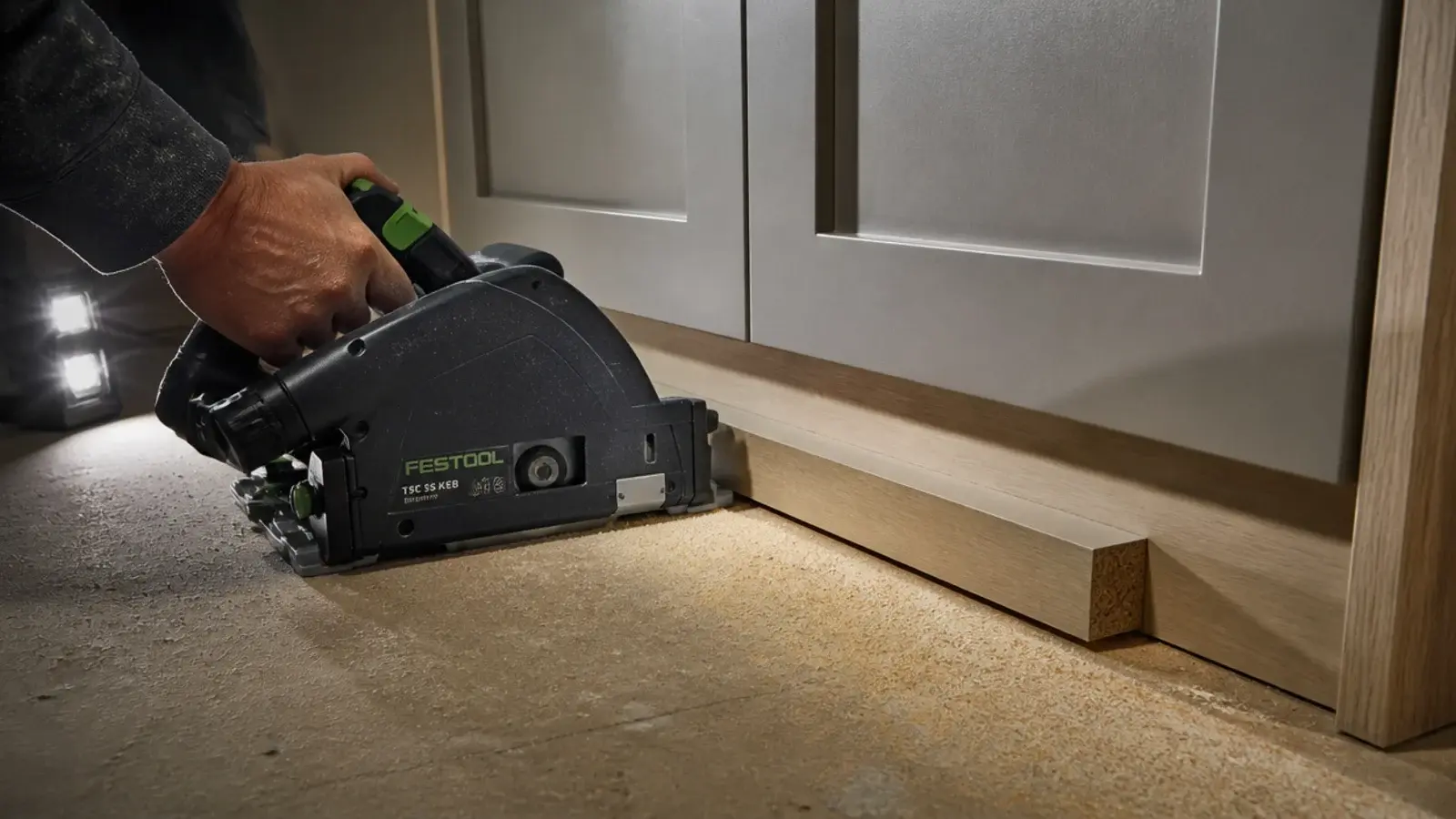 flush saw cutting beneath a wardrobe plinth so boards slide underneath