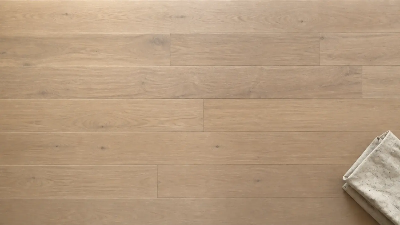 matte finished floorboards refusing to reflect a window above them