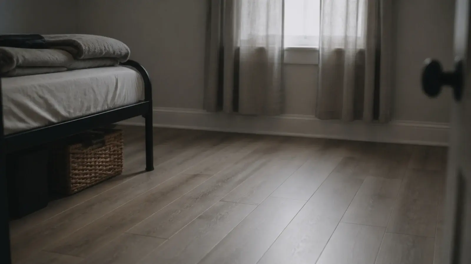 slim budget vinyl planks laid across a quiet spare bedroom floor