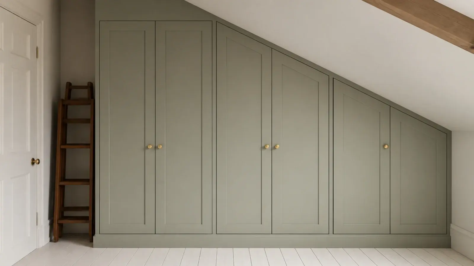built in wardrobe with its top edge cut to follow the roof pitch