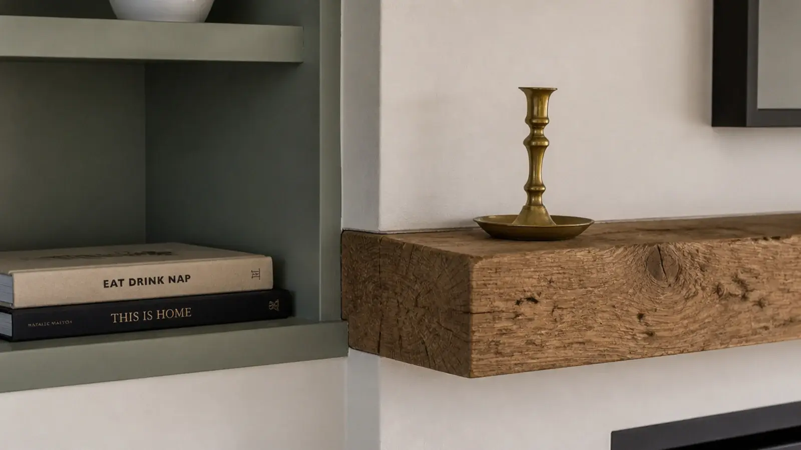 alcove shelf aligned exactly with a wooden mantel beside a fireplace
