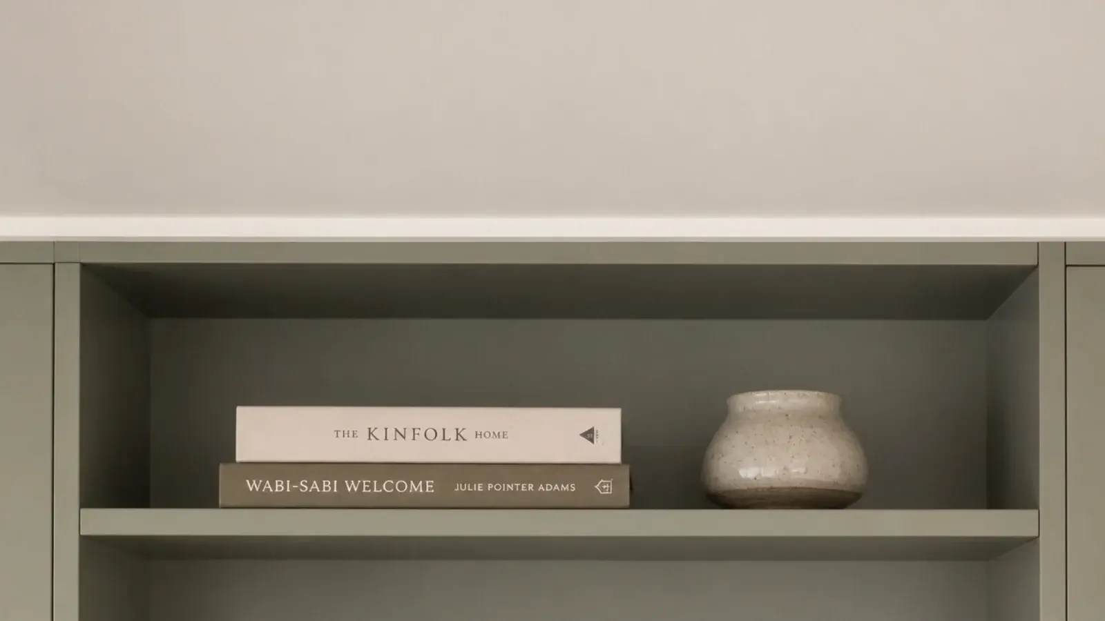 plain cove moulding capping farmhouse built-in shelves at the ceiling