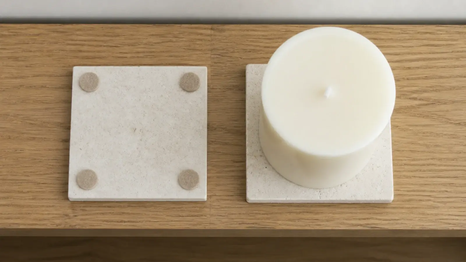 felt pads and a tile coaster placed under candles on a wooden shelf