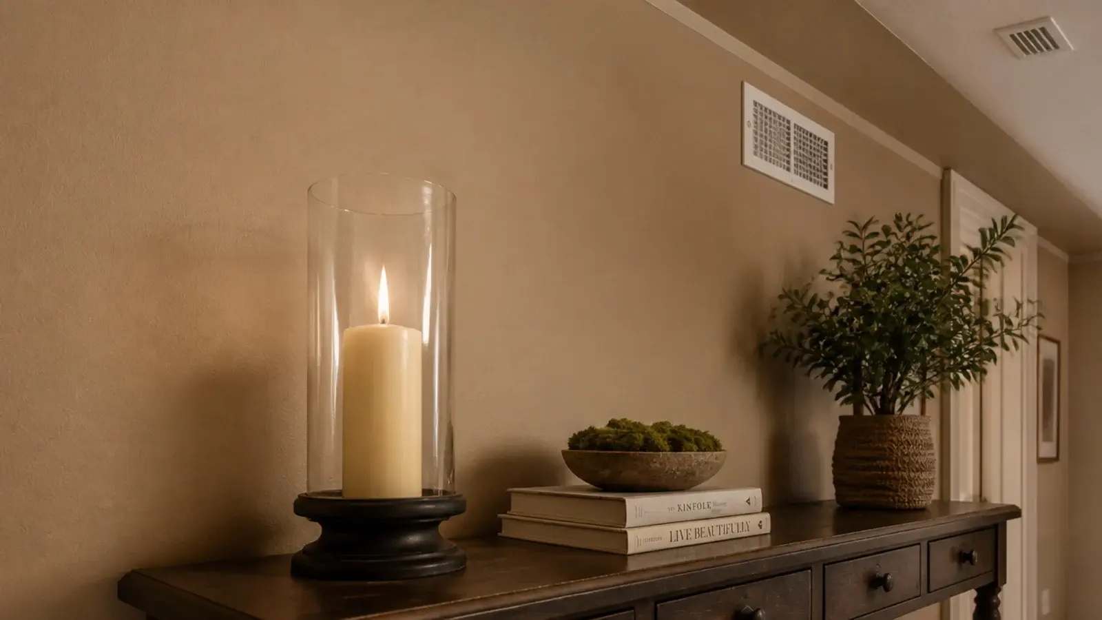 candle moved away from a ceiling vent and covered by a glass hurricane