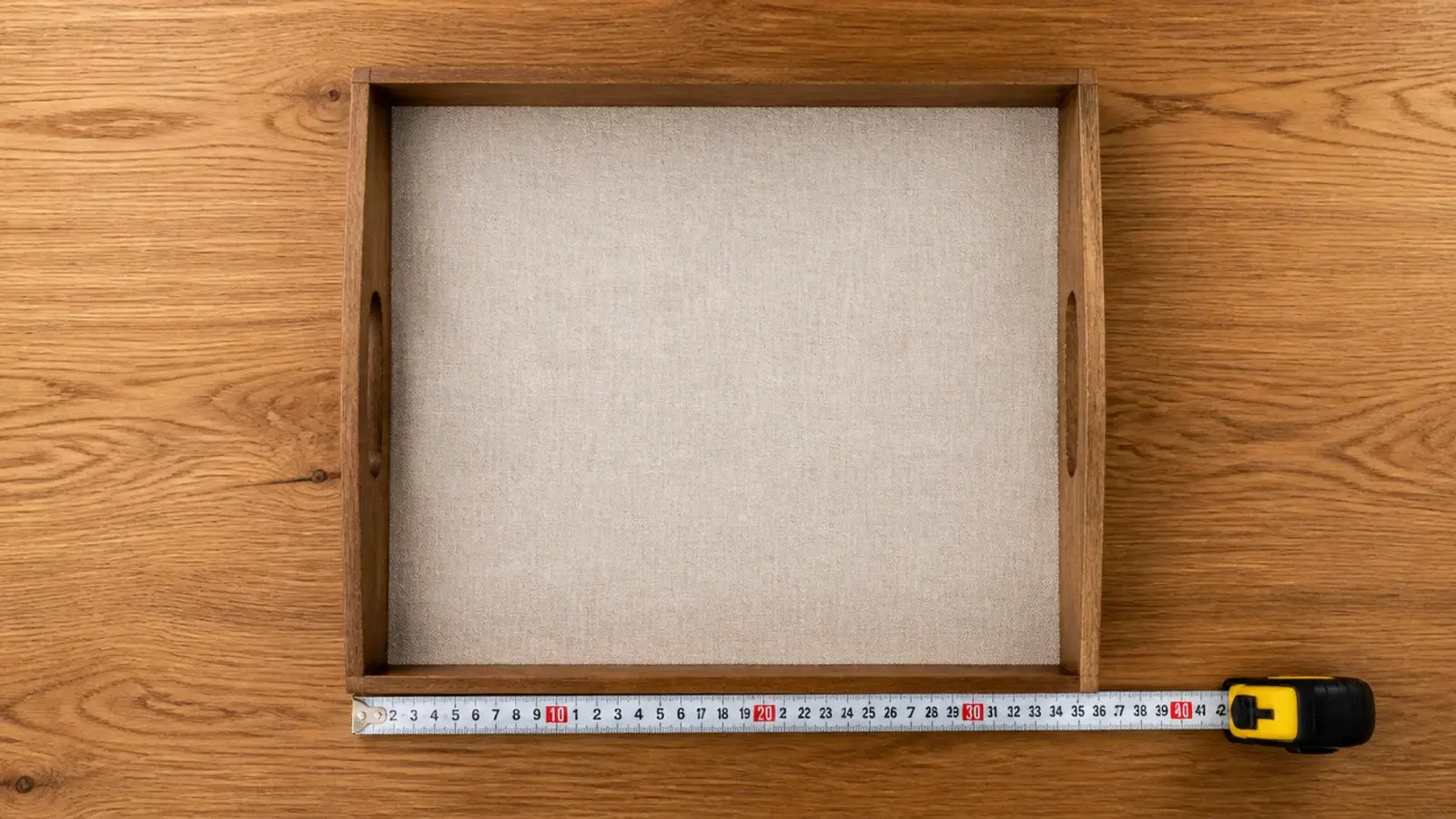 linen lined tray covering roughly a third of a wooden table top