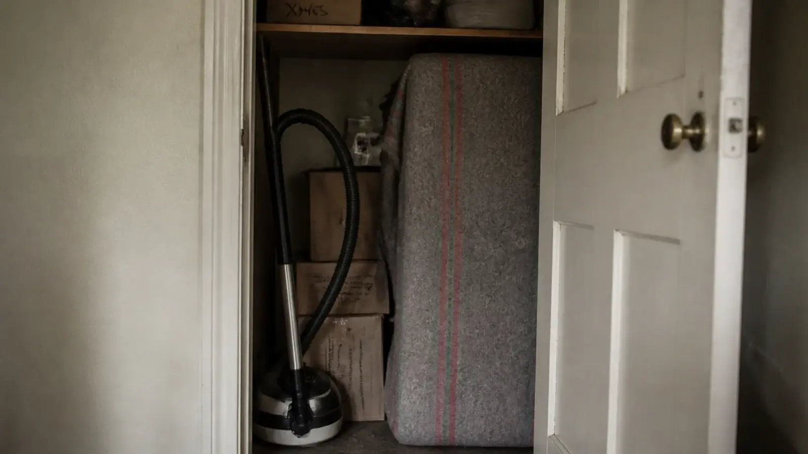 landlord table wrapped in a blanket and stored in a cupboard