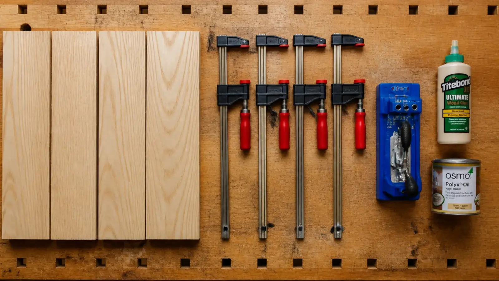 timber boards clamps pocket hole jig and glue laid out on a bench