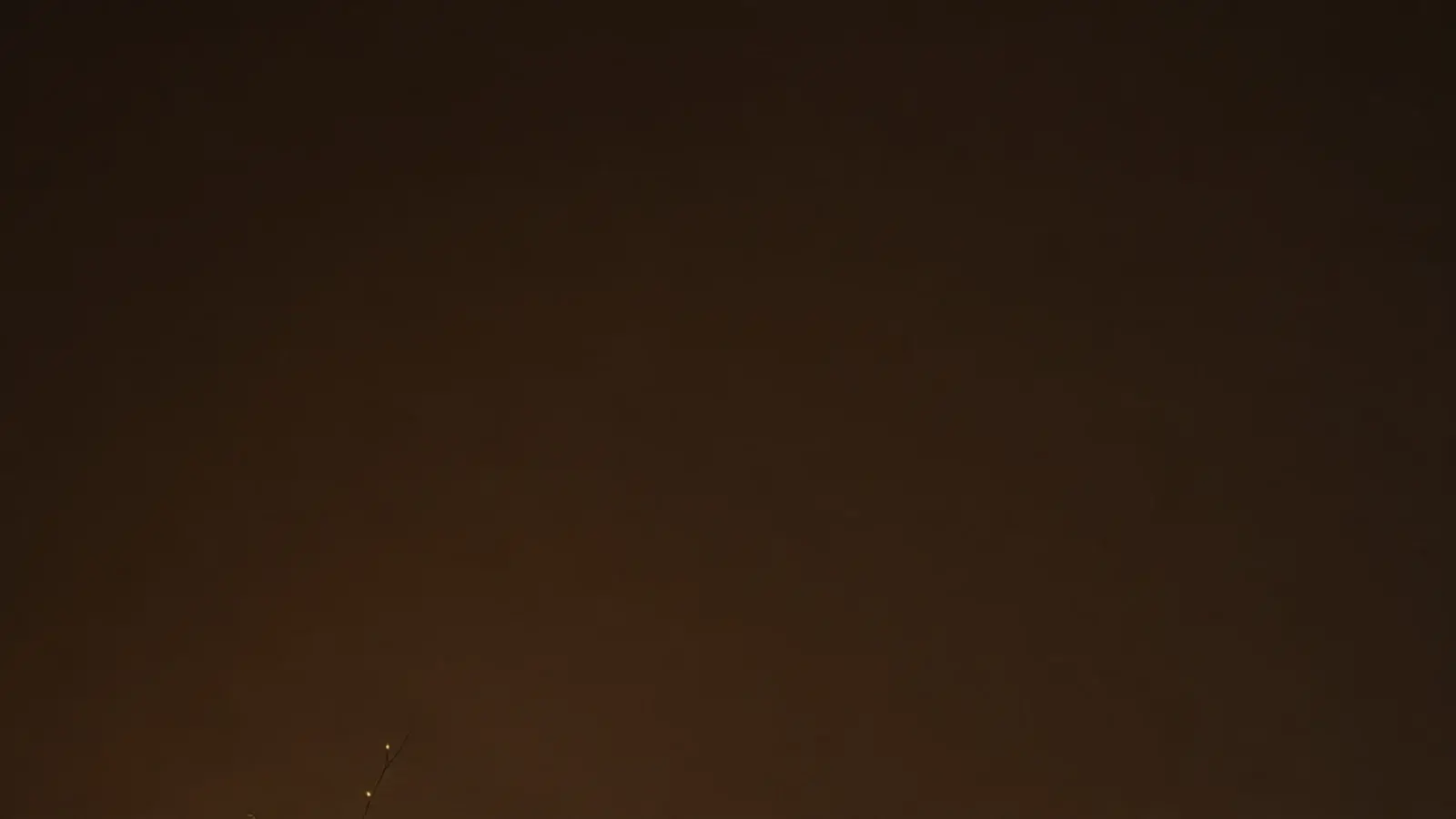 tall bedroom view of lit jars lanterns and decor objects together