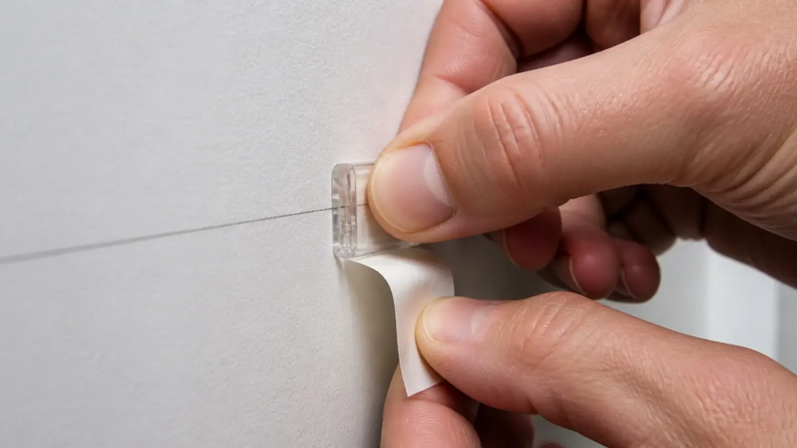 clip being pressed firmly at the end of a marked wall run