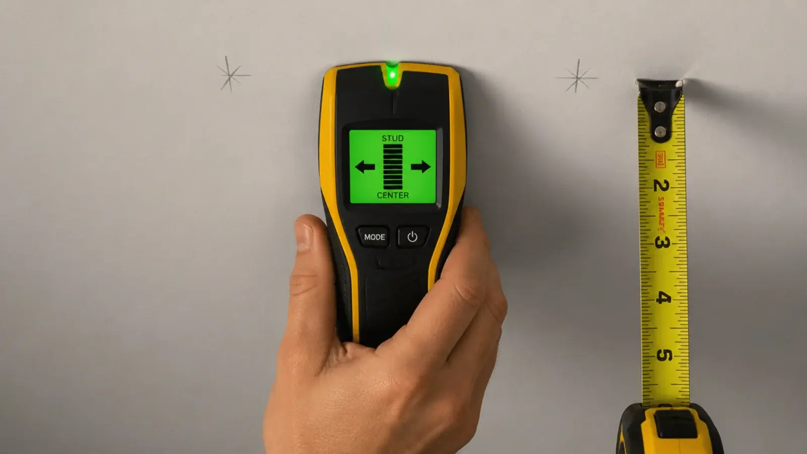 stud finder sweeping a kitchen ceiling above an island counter