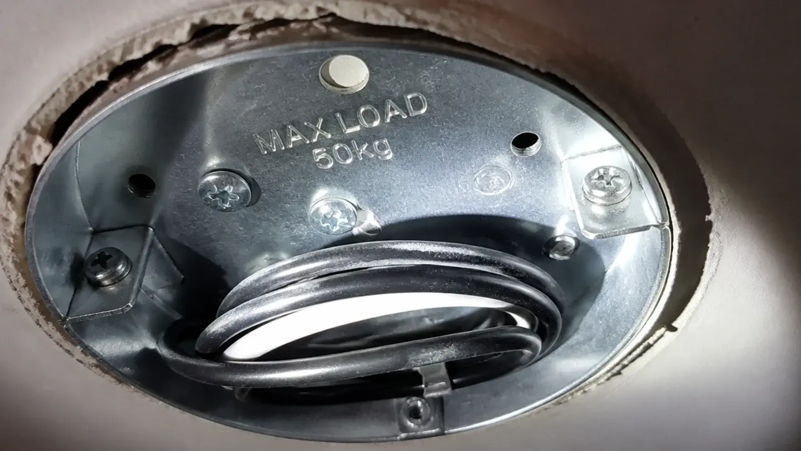 rating stamp visible inside an open kitchen ceiling mounting box
