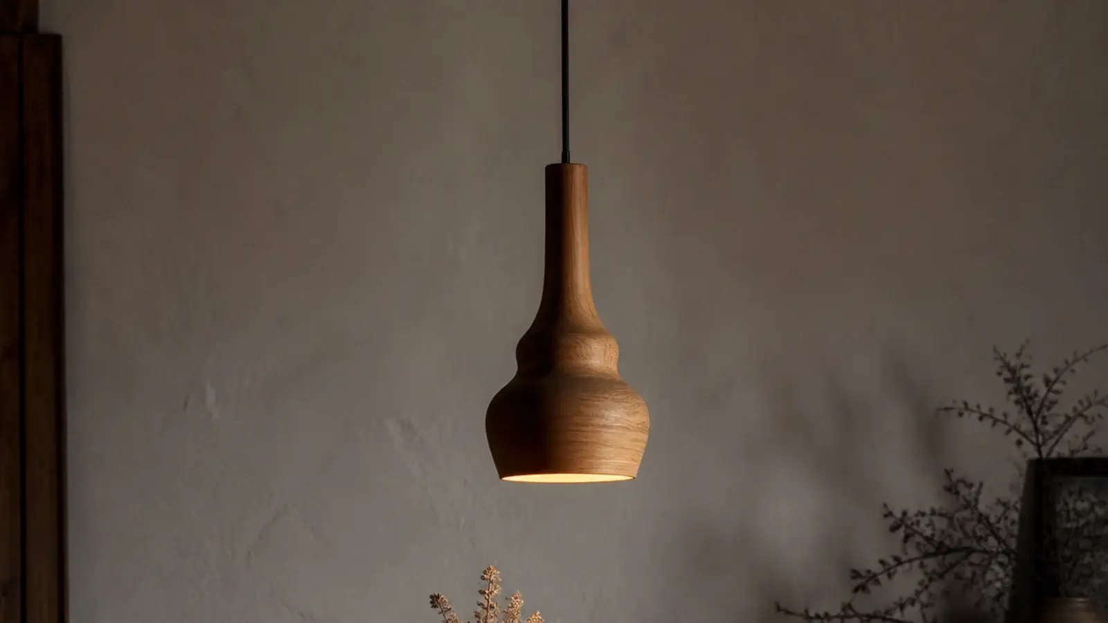 tall view of wooden hanging lights above a warm timber interior