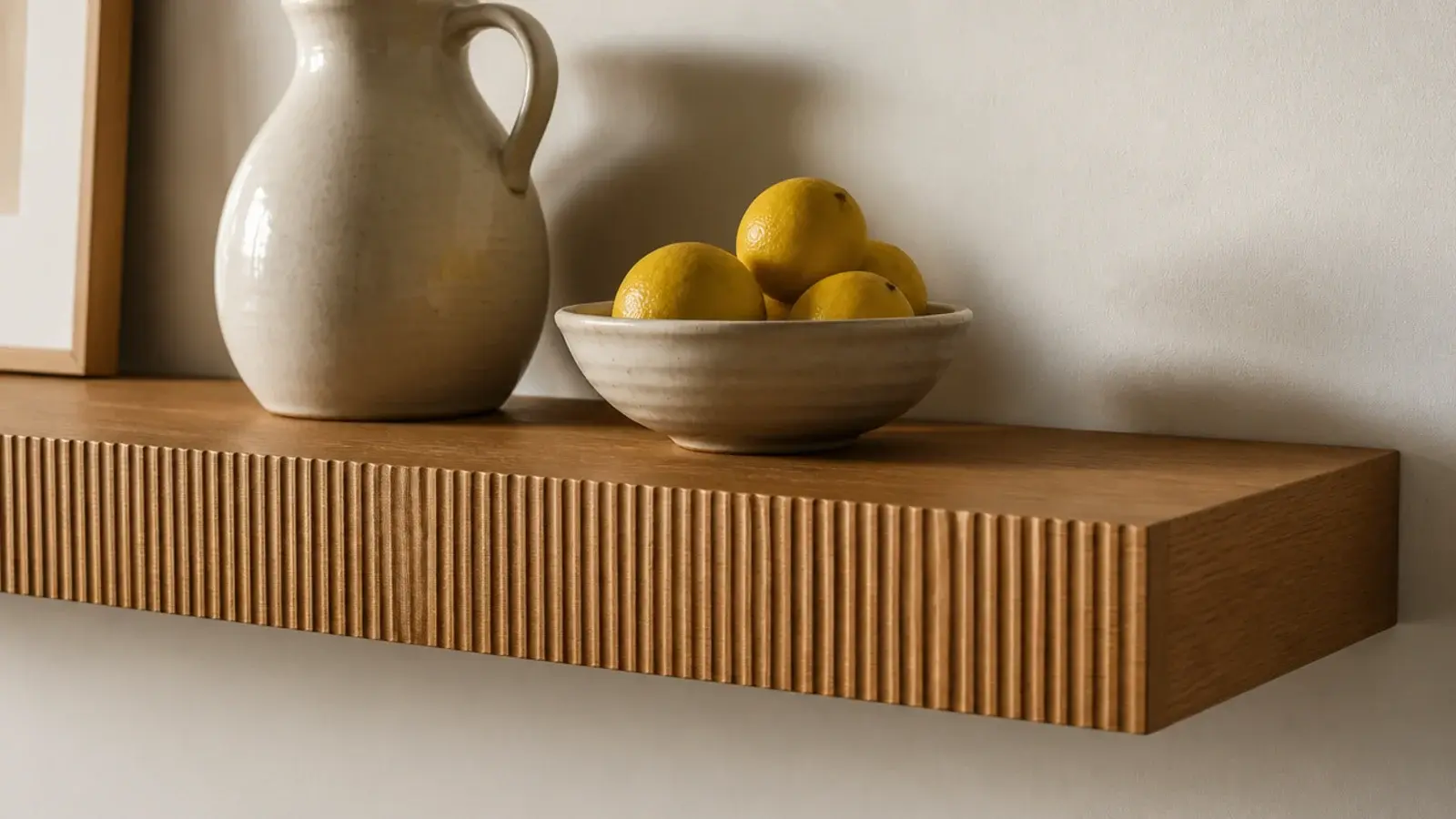 reeded oak shelf front detail catching light in a modern kitchen