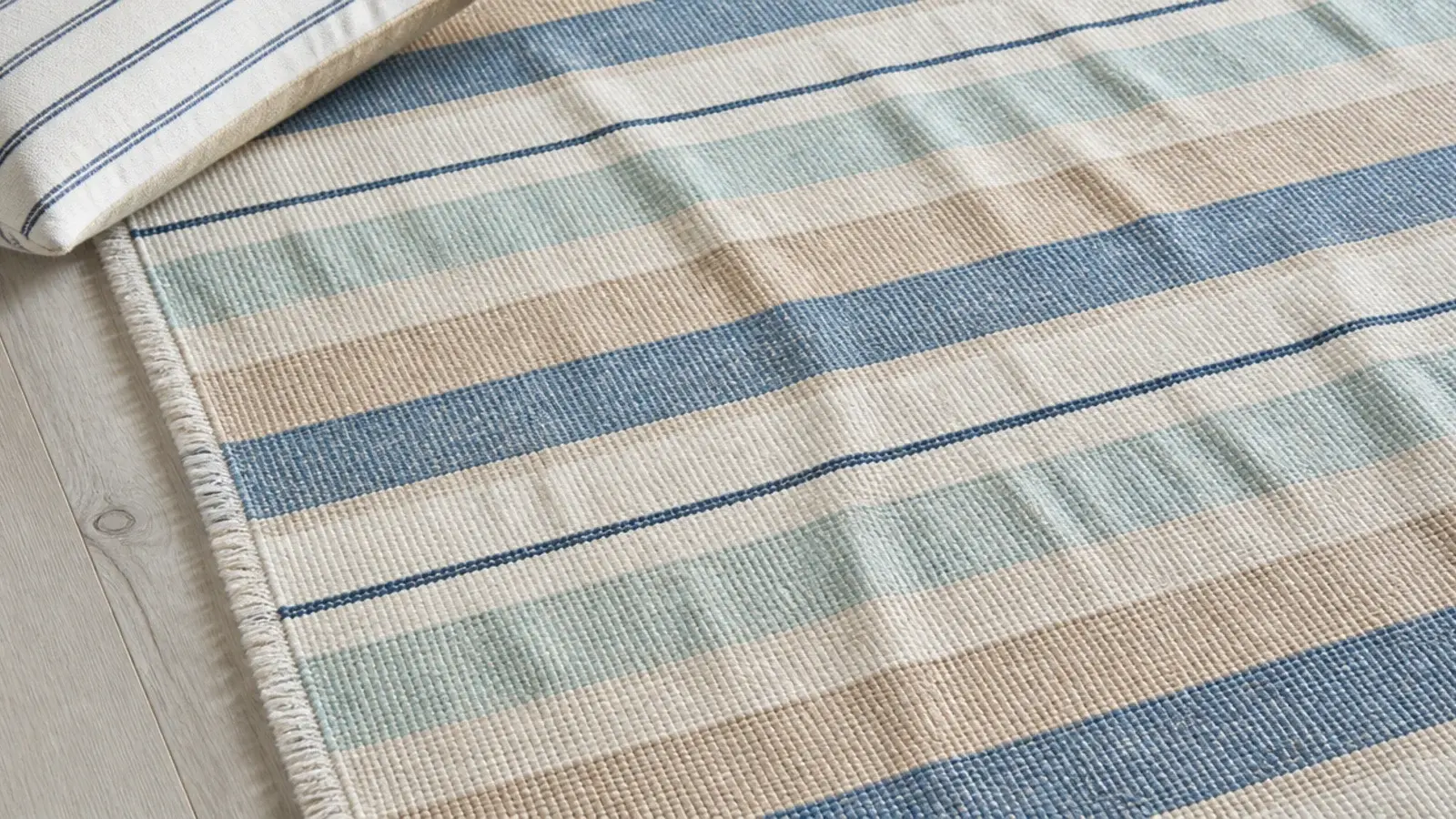 striped cotton flatweave dhurrie showing soft creases after washing