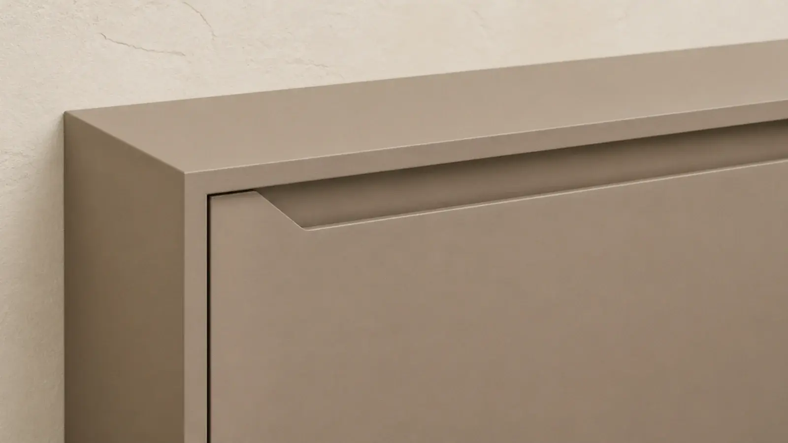 handleless modern shoe cabinet with a routed finger pull along the door top
