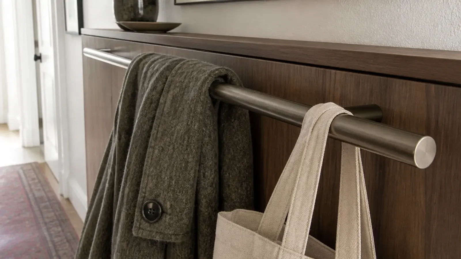 protruding cabinet handle catching a coat sleeve in a narrow hallway
