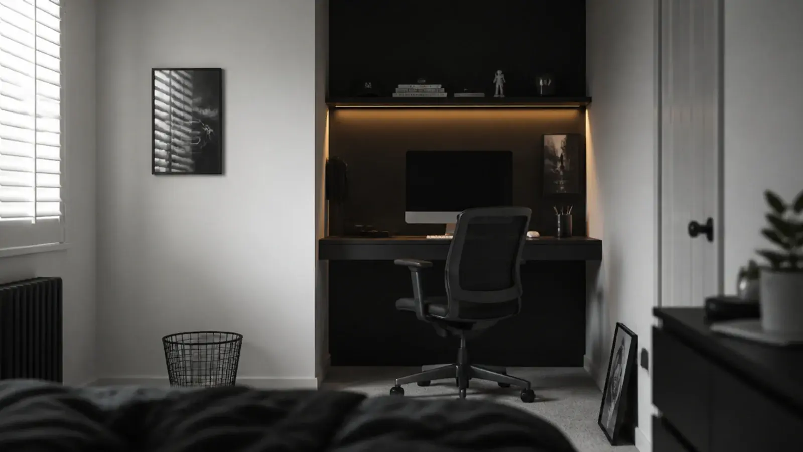 black painted alcove holding a gaming setup inside a pale bedroom