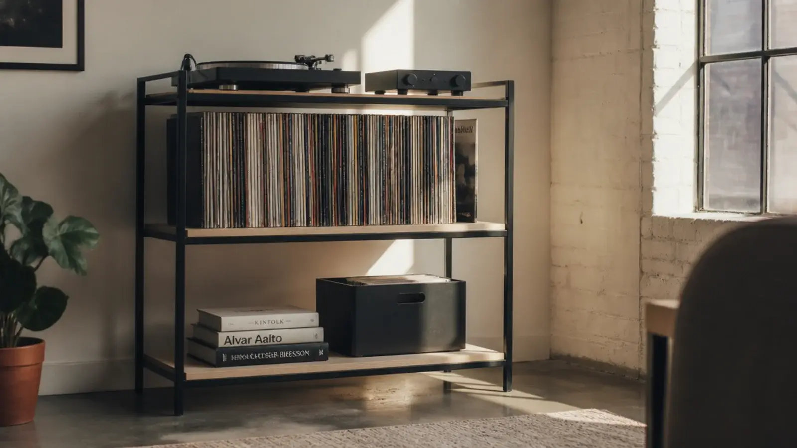 black steel framed media unit holding plywood shelves and records