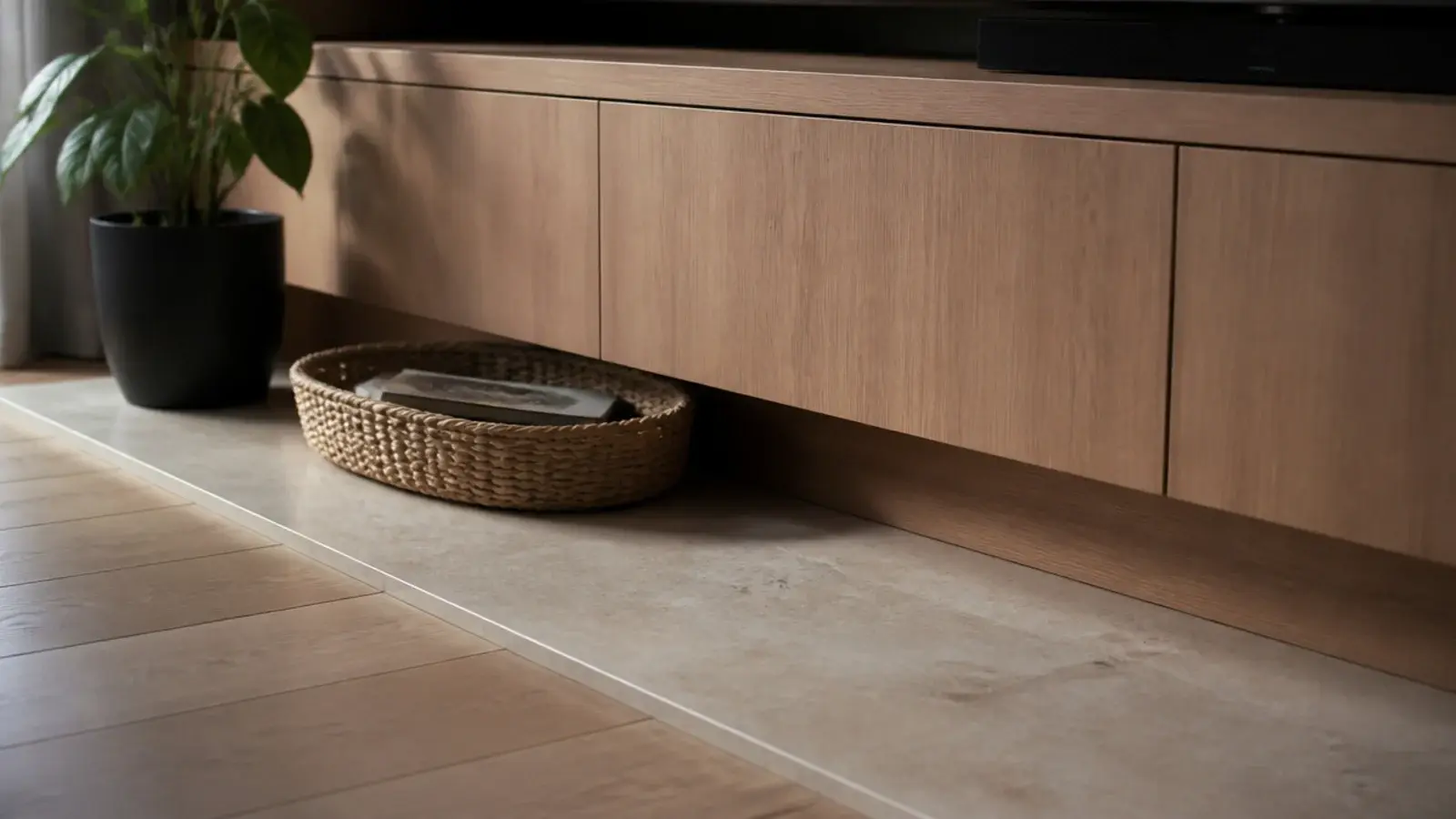 stone slab set into the floor beneath a media wall like a hearth