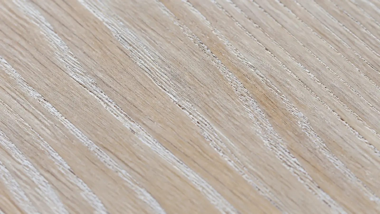 limed oak surface with white pigment sitting in the open grain