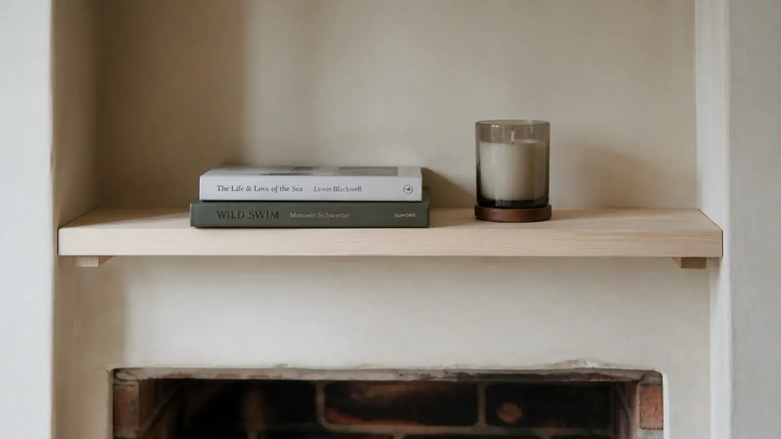 plain timber board wedged into an alcove as a simple display shelf