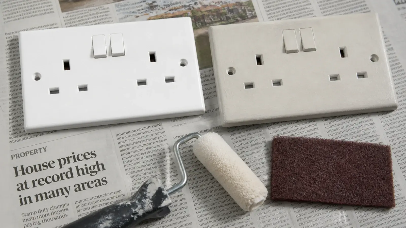 socket faceplate rolled in wall colour beside an unpainted white one