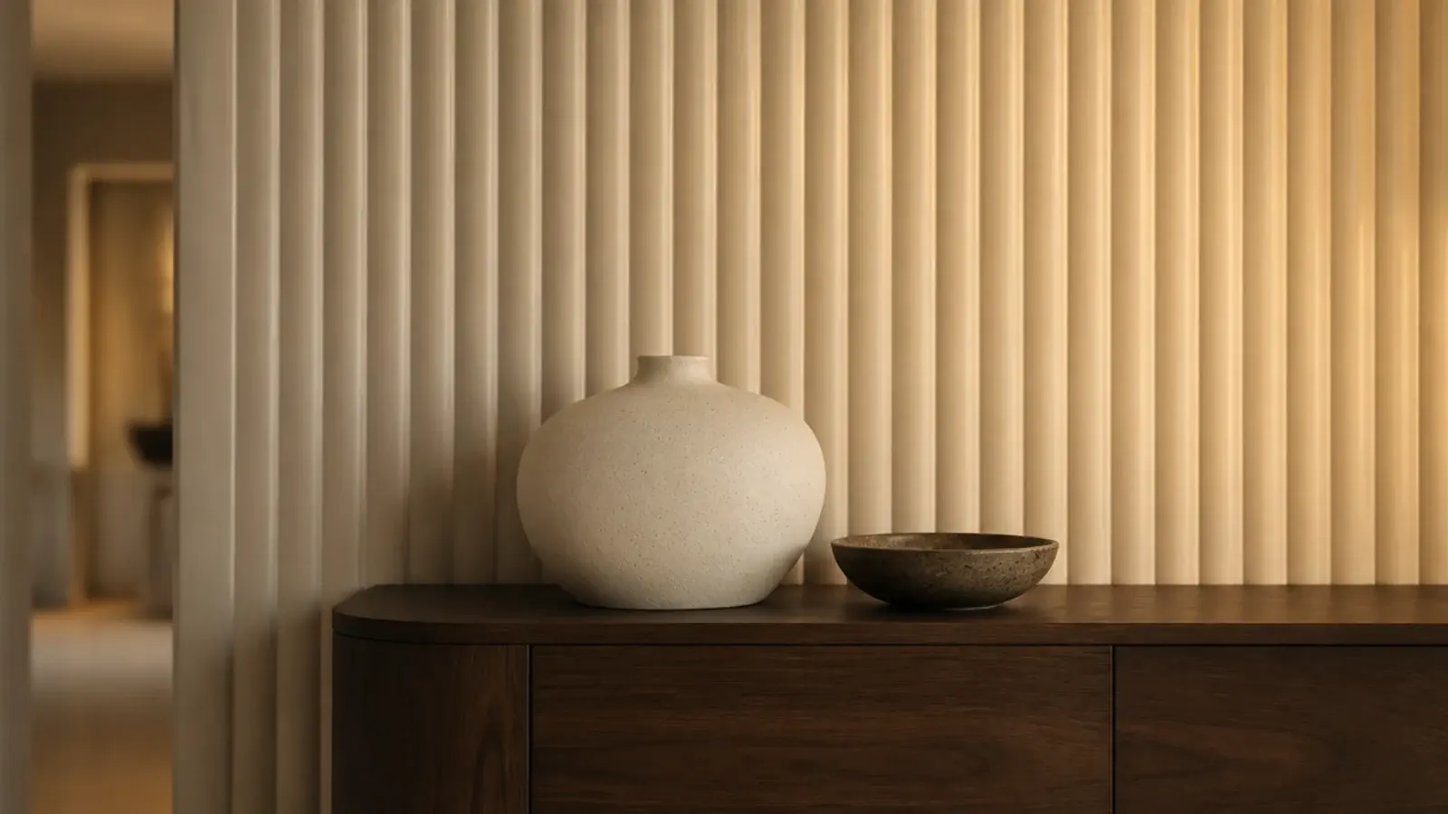 painted fluted mdf panelling running full height behind a low console
