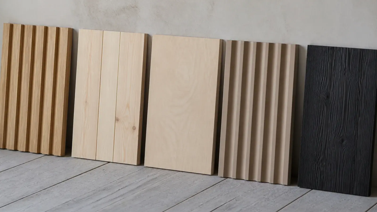 wood wall design samples in oak pine and charred cedar leaning together