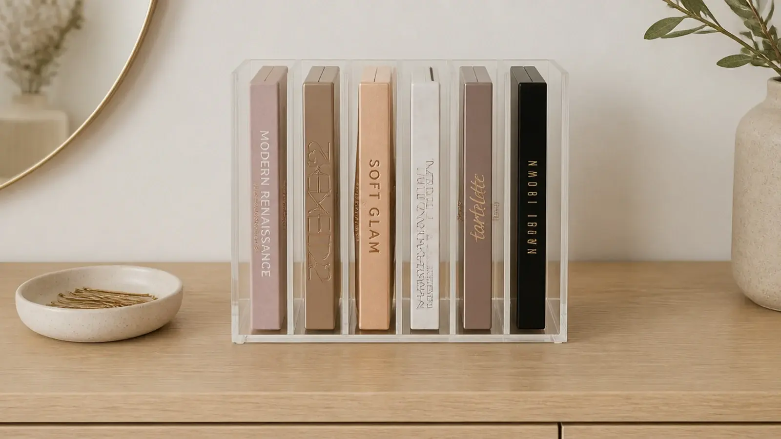 acrylic file rack holding eyeshadow palettes standing upright like books