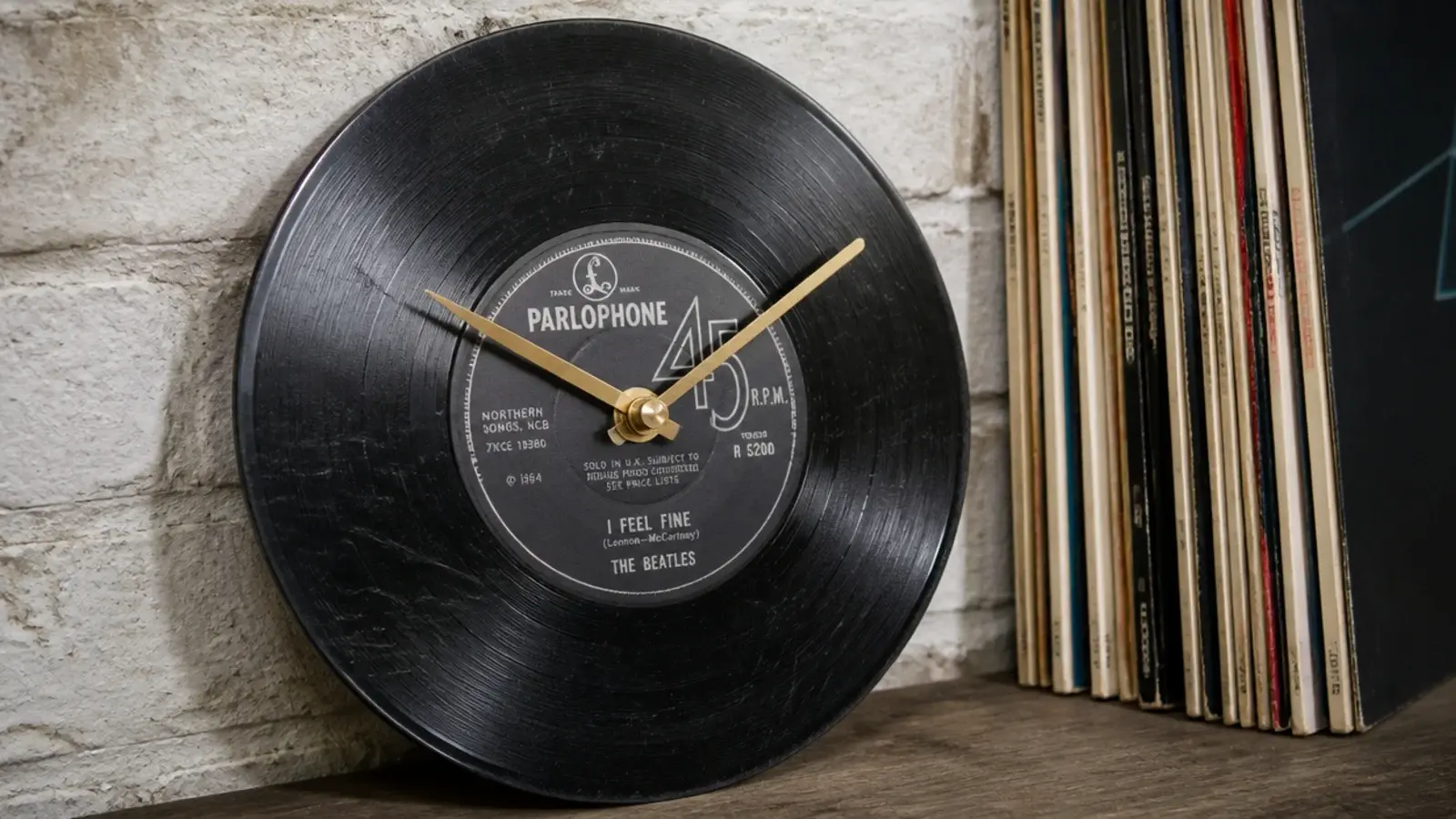 old vinyl record converted into a clock with slim hands