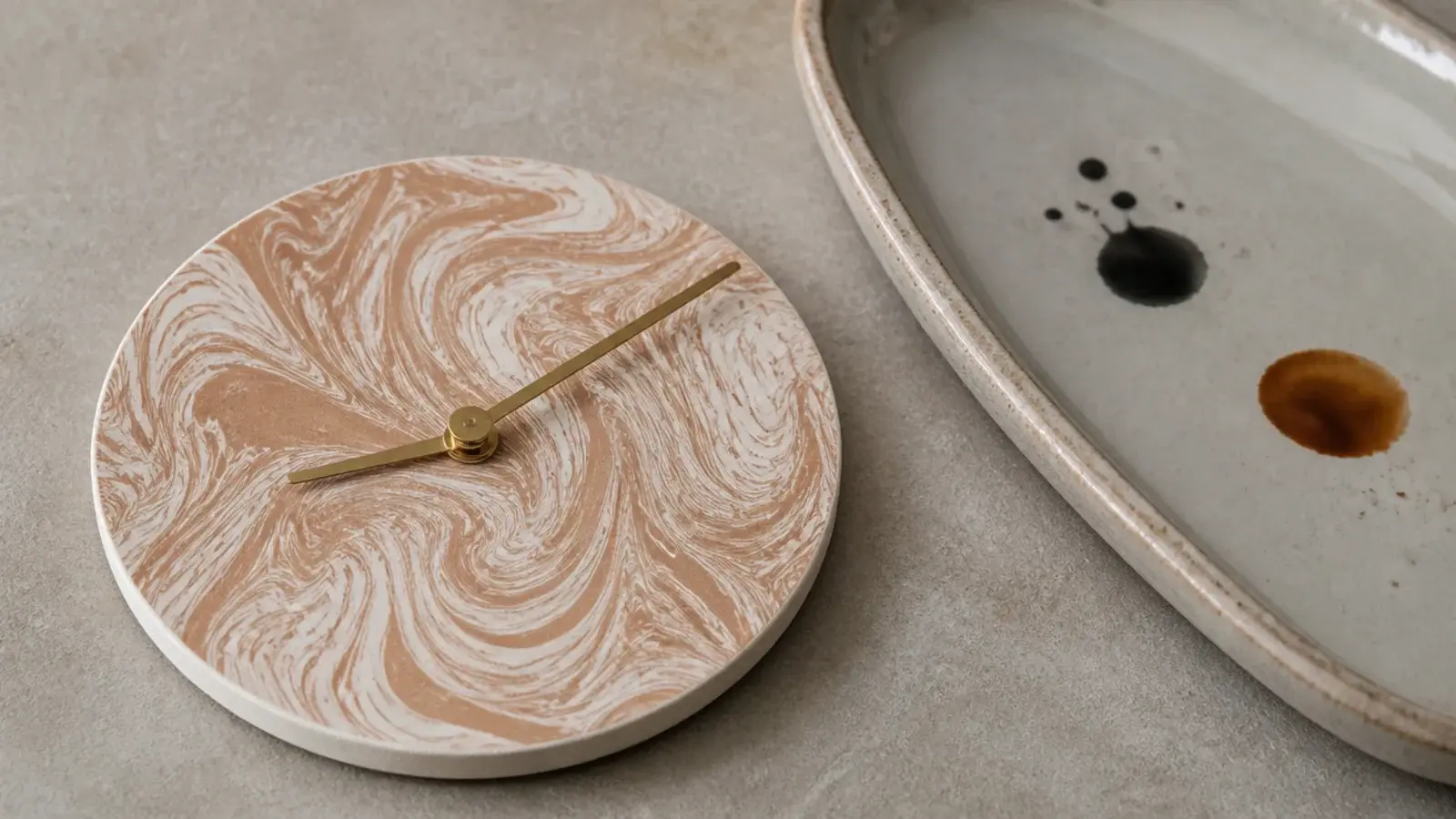 marbled paper disc mounted on card as a swirled clock face