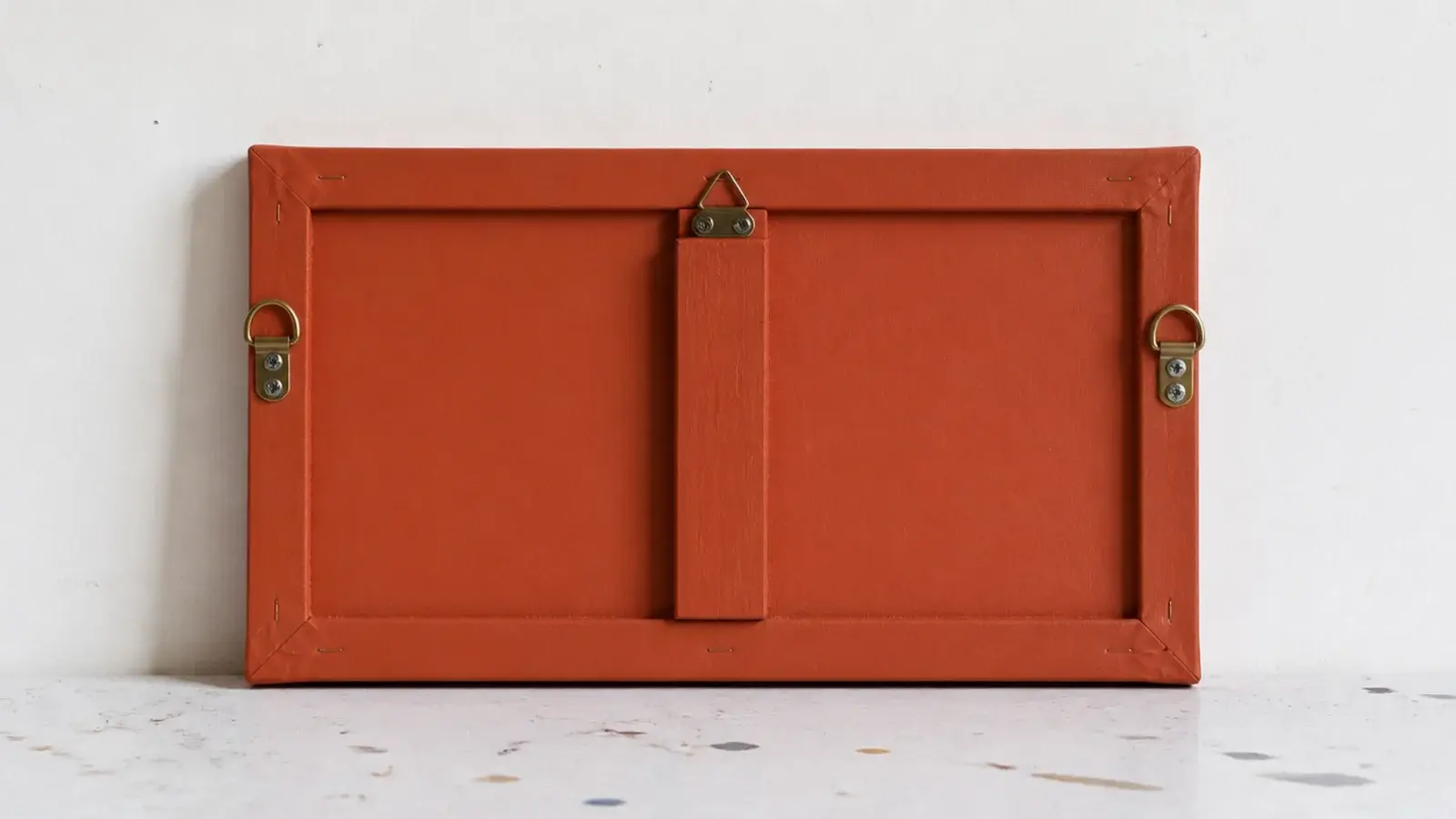 small stretched canvas painted flat and fitted with clock hands