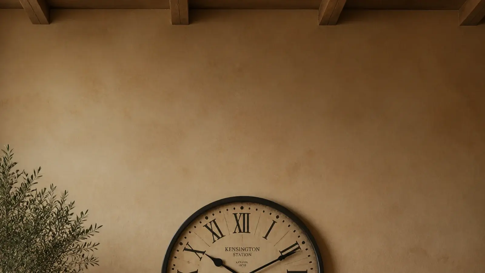 tall view of a sofa wall with a clock planned and hung level