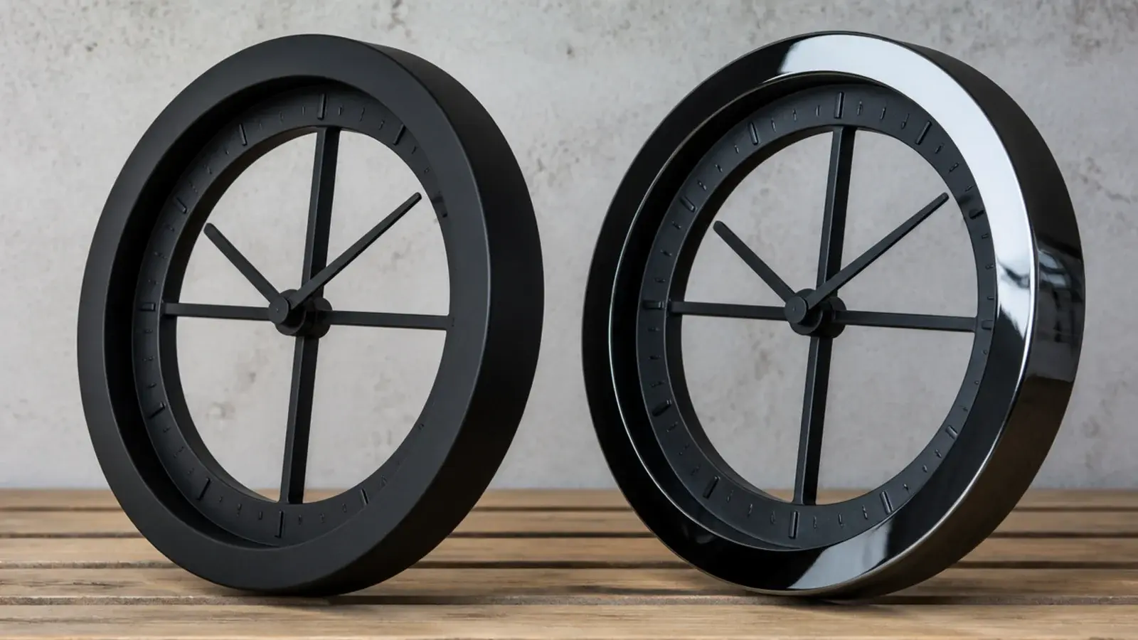 matte black clock rim absorbing light beside a glossy alternative