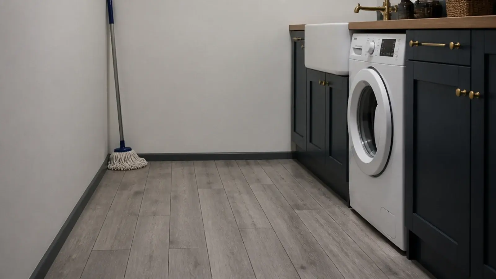 grey wood effect planks in a utility room beside a washing machine
