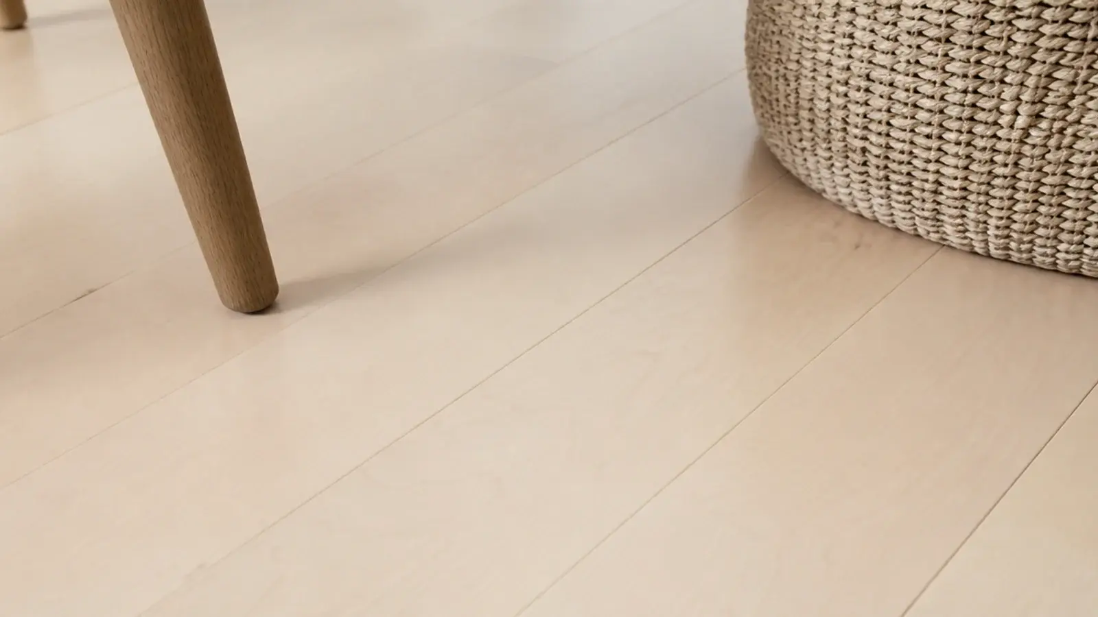 fine grained maple floorboards reading almost as a single pale surface