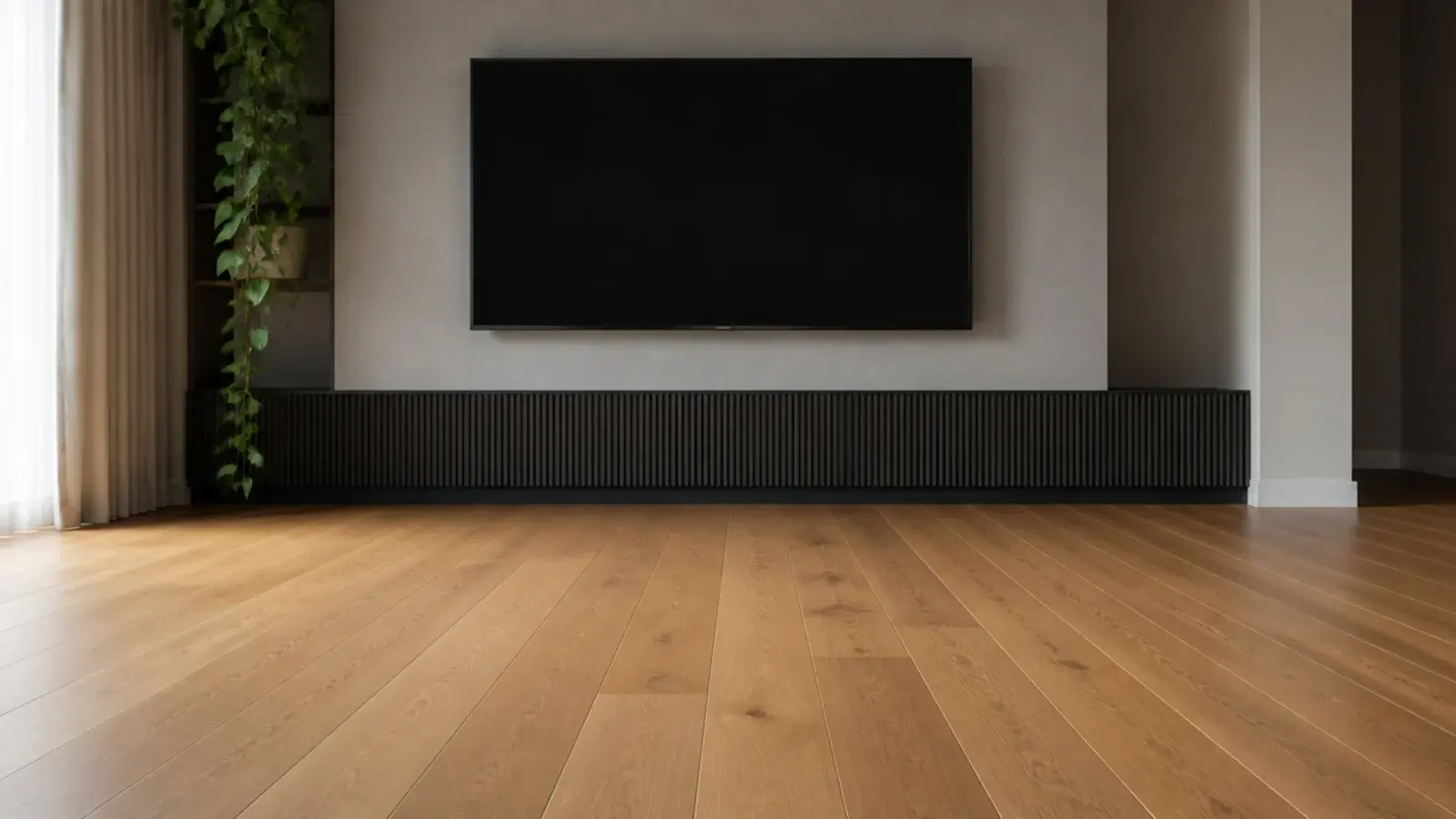 clear span of floorboards in front of a low television wall