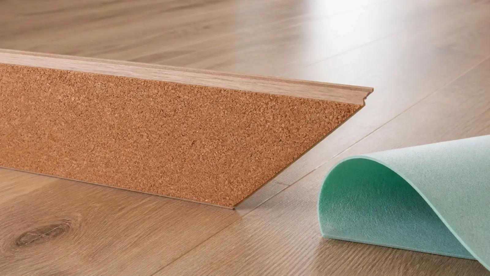 cork backing visible on the underside of a lifted wood effect plank