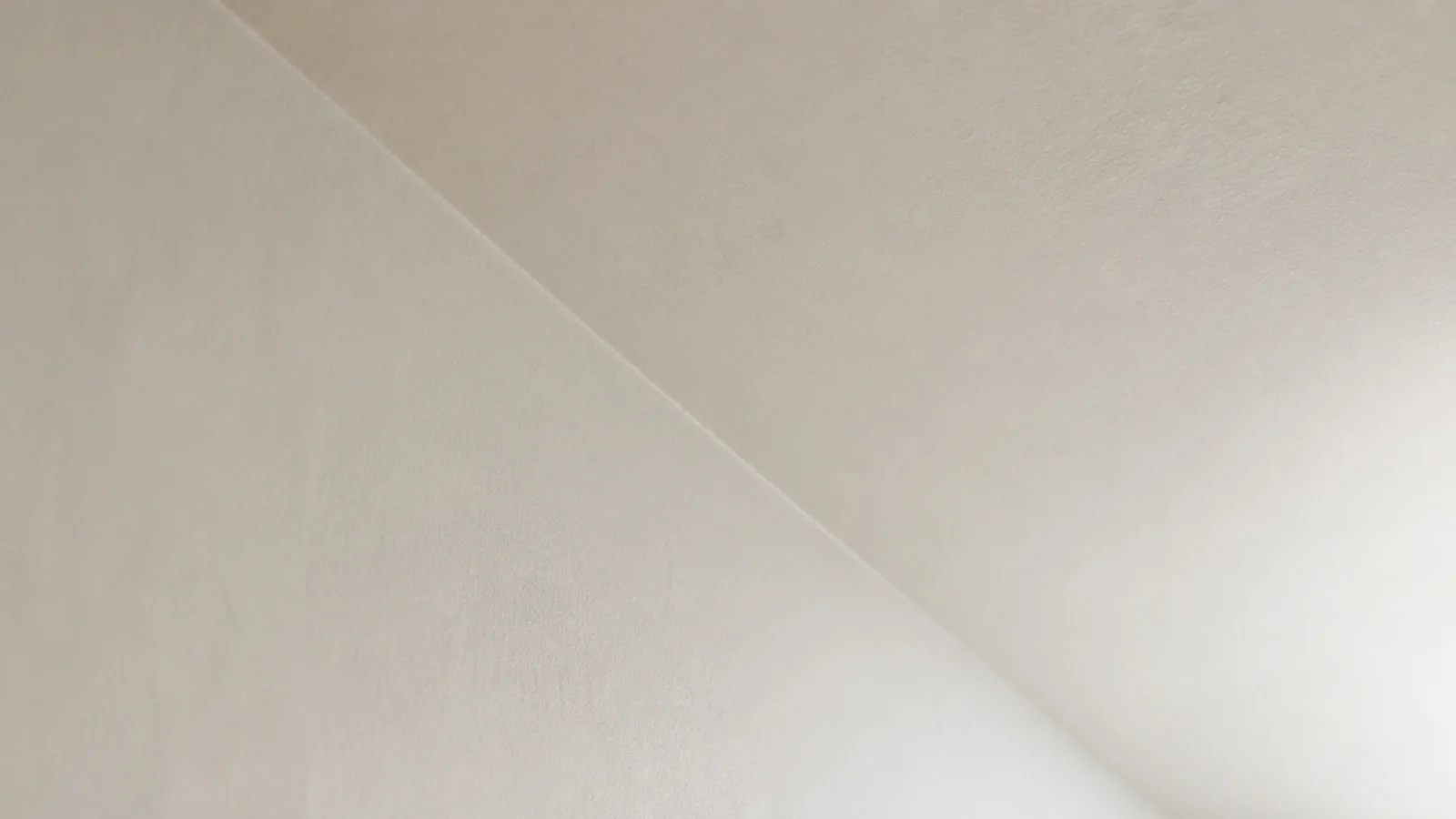 wall and sloping ceiling painted one tone with no cut line between