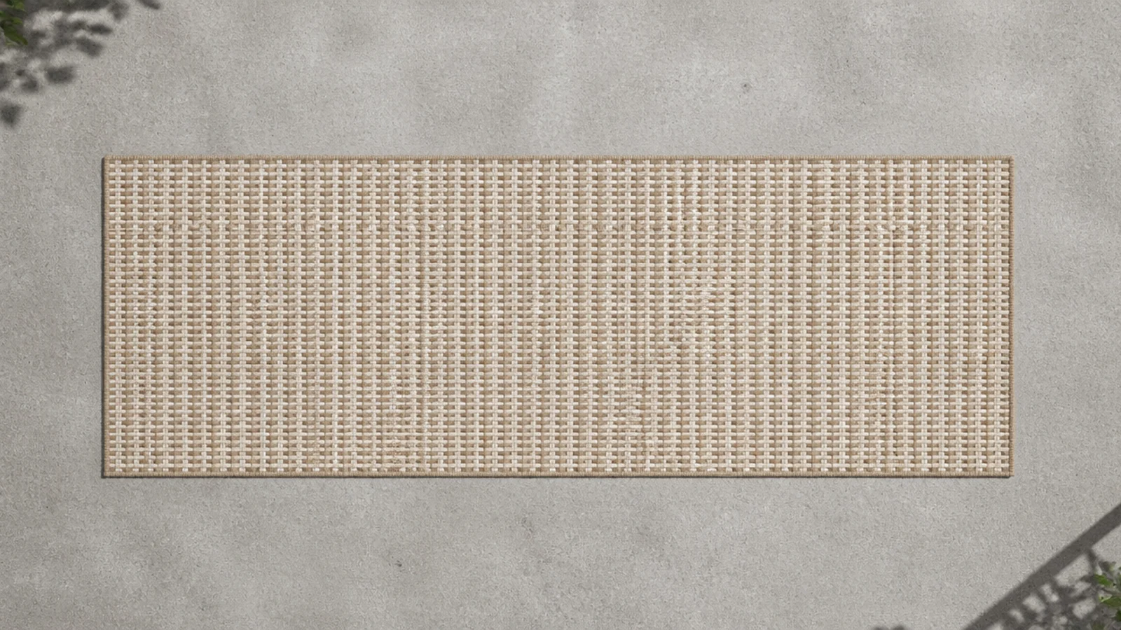 open weave flatwoven runner laid across grey balcony concrete