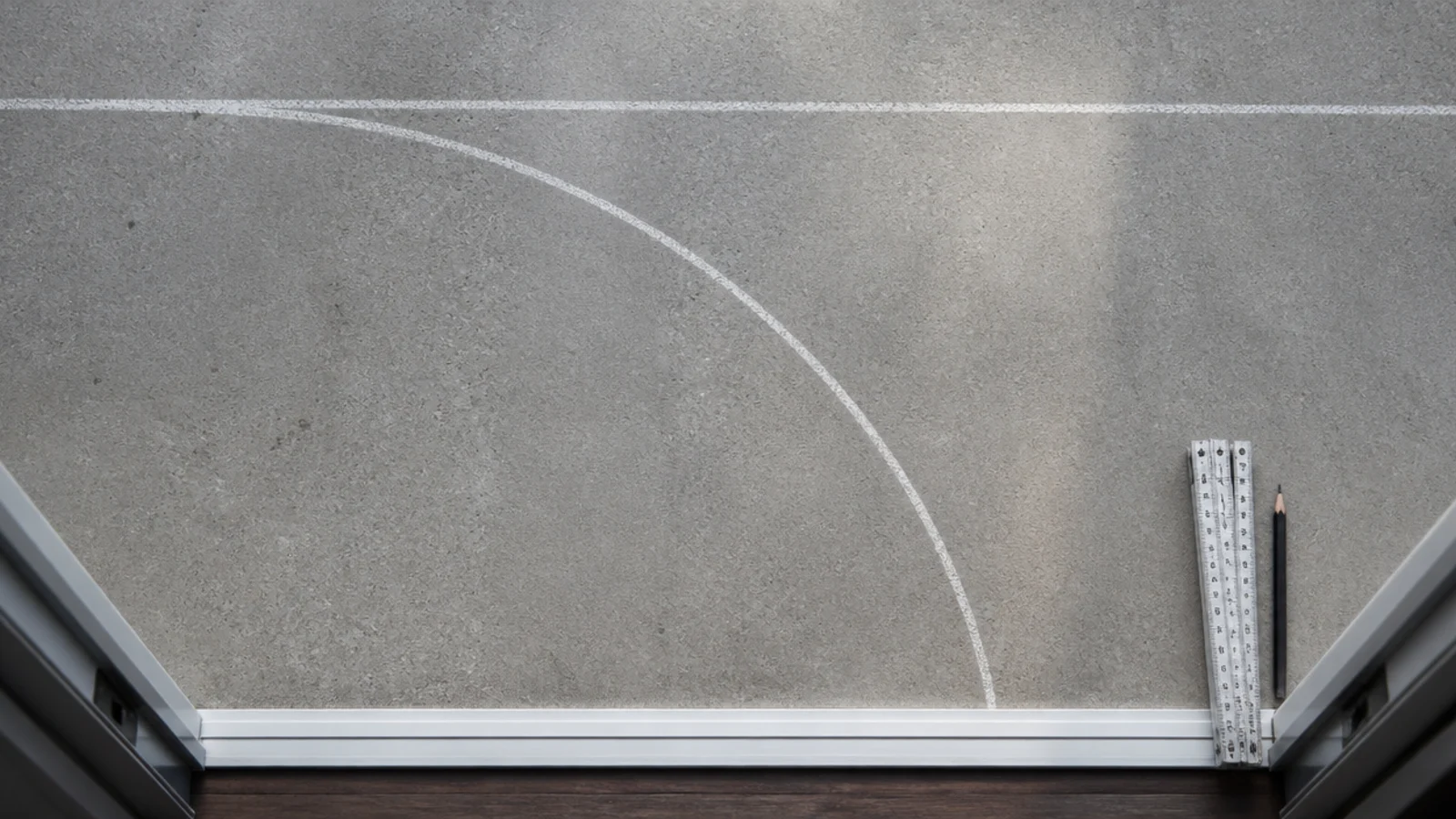 chalk arc on balcony concrete marking a sliding door swing clearance