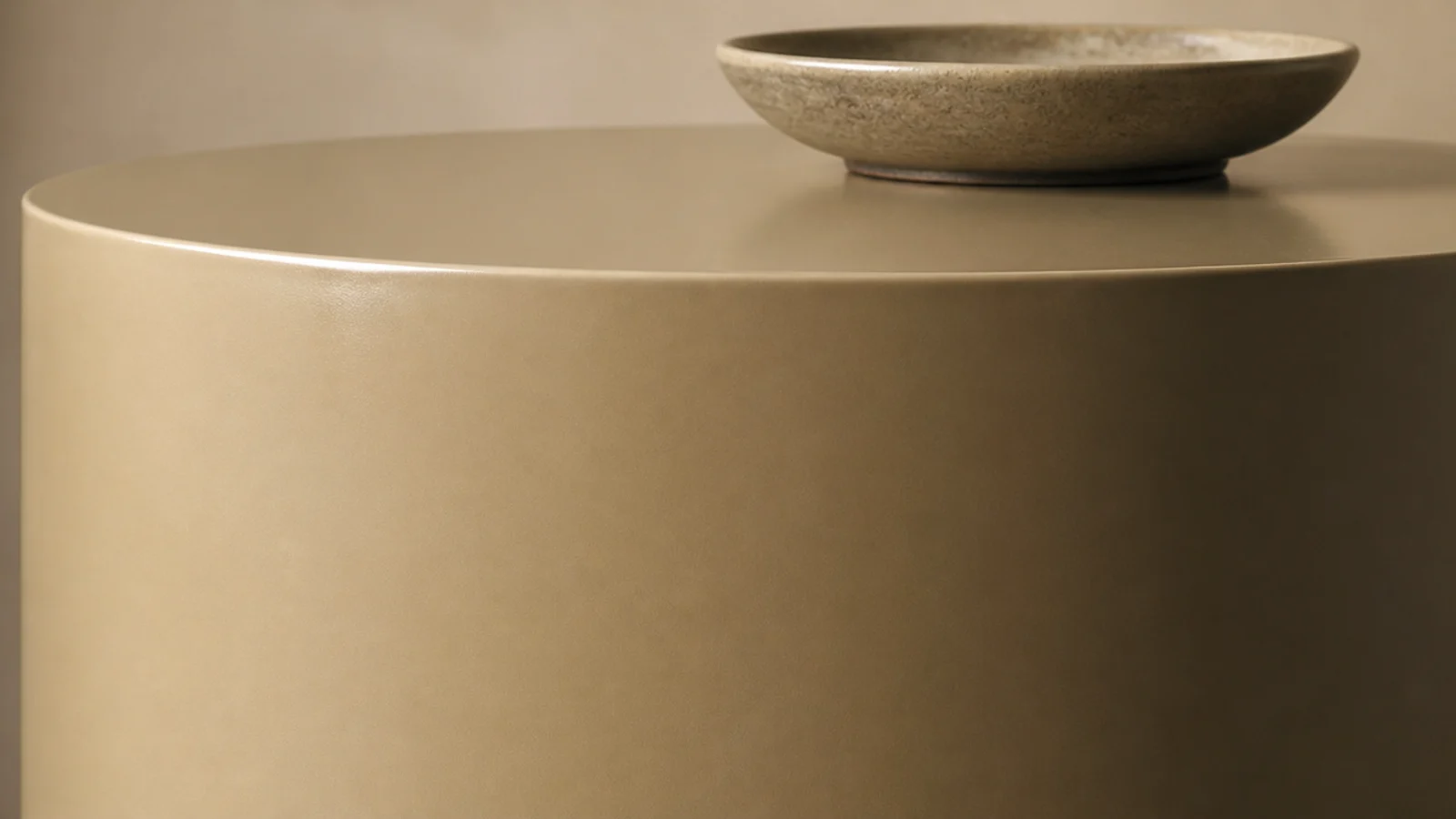cylindrical drum side table with a continuous unbroken outer surface