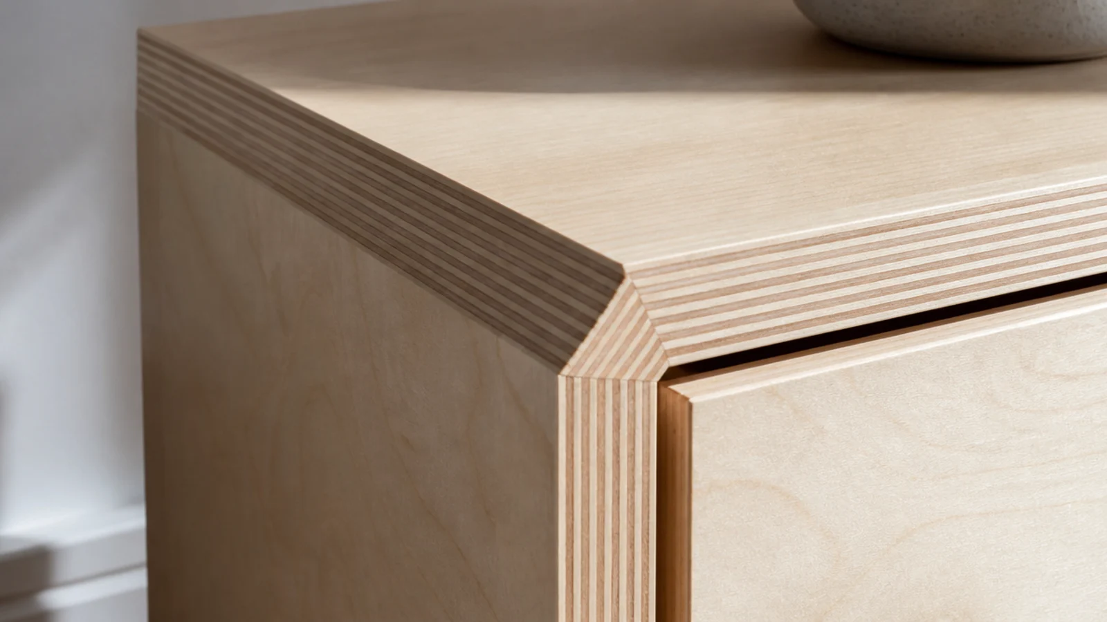 birch plywood nightstand with striped edge laminations turning the corner