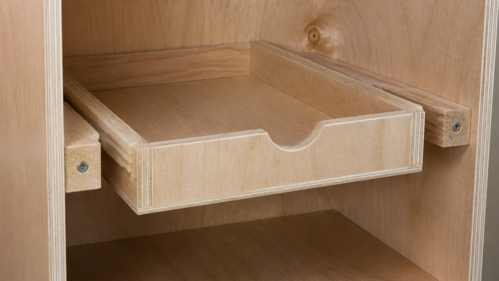 wooden cleats screwed inside a cabinet carrying a simple sliding drawer