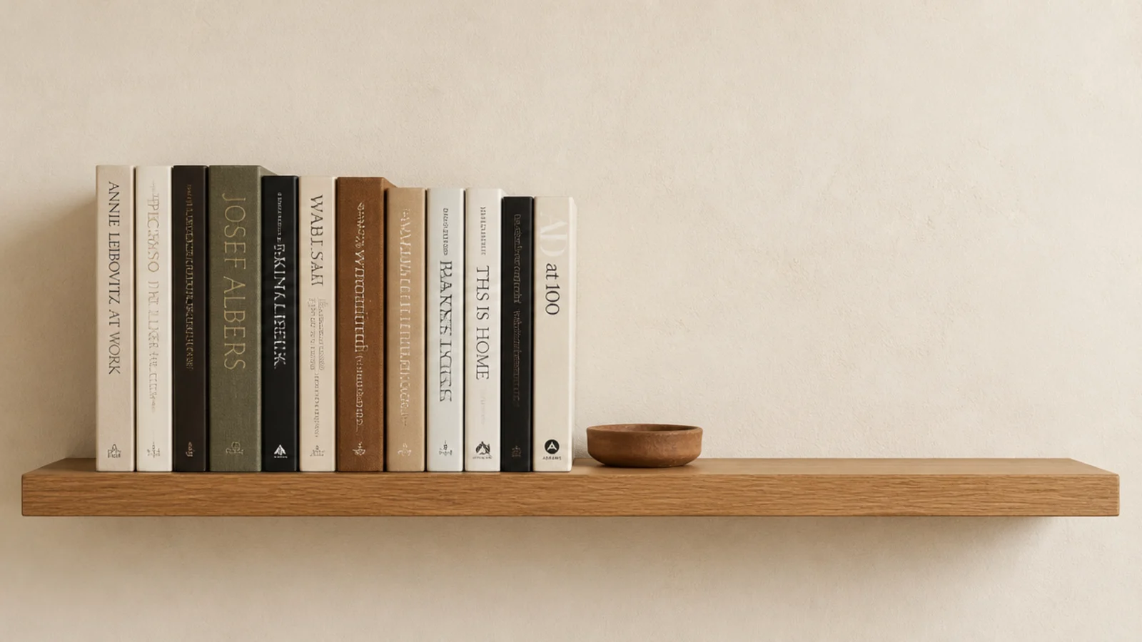 bookshelf styling with books filling two thirds and a clear open gap