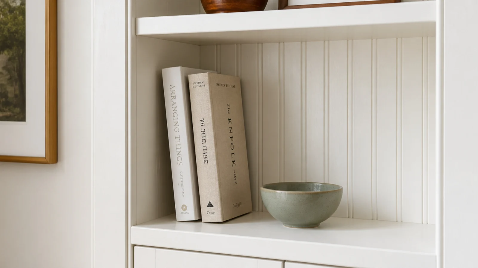 textured back panels replacing shiny printed board behind built-in shelves