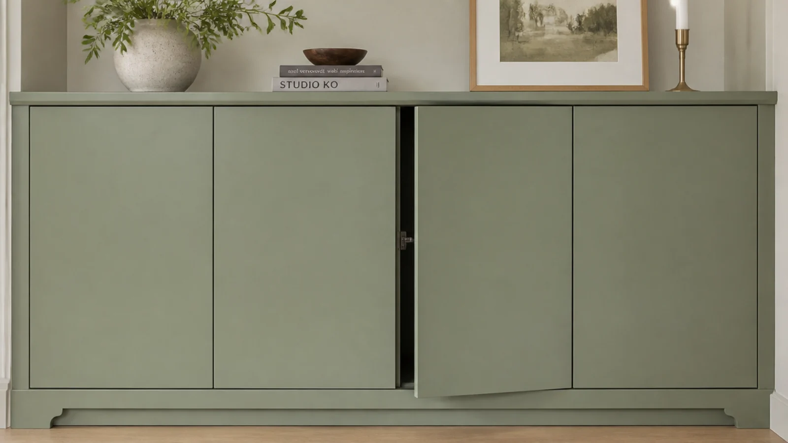 handleless push latch cabinet doors in a run of living room built-ins