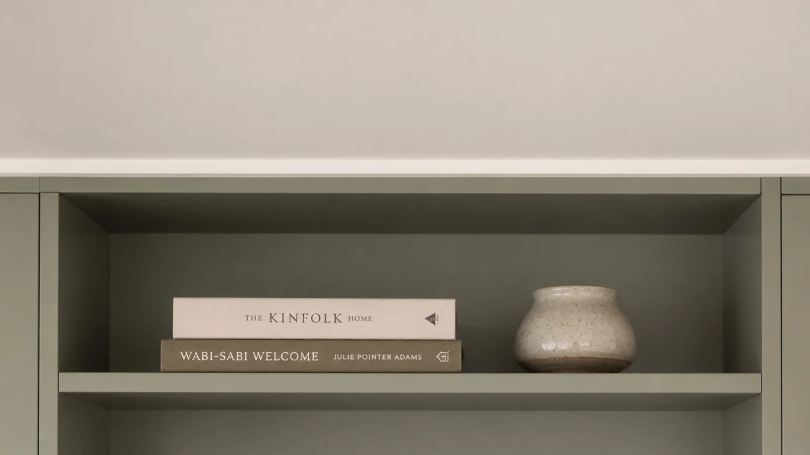 plain cove moulding capping farmhouse built-in shelves at the ceiling
