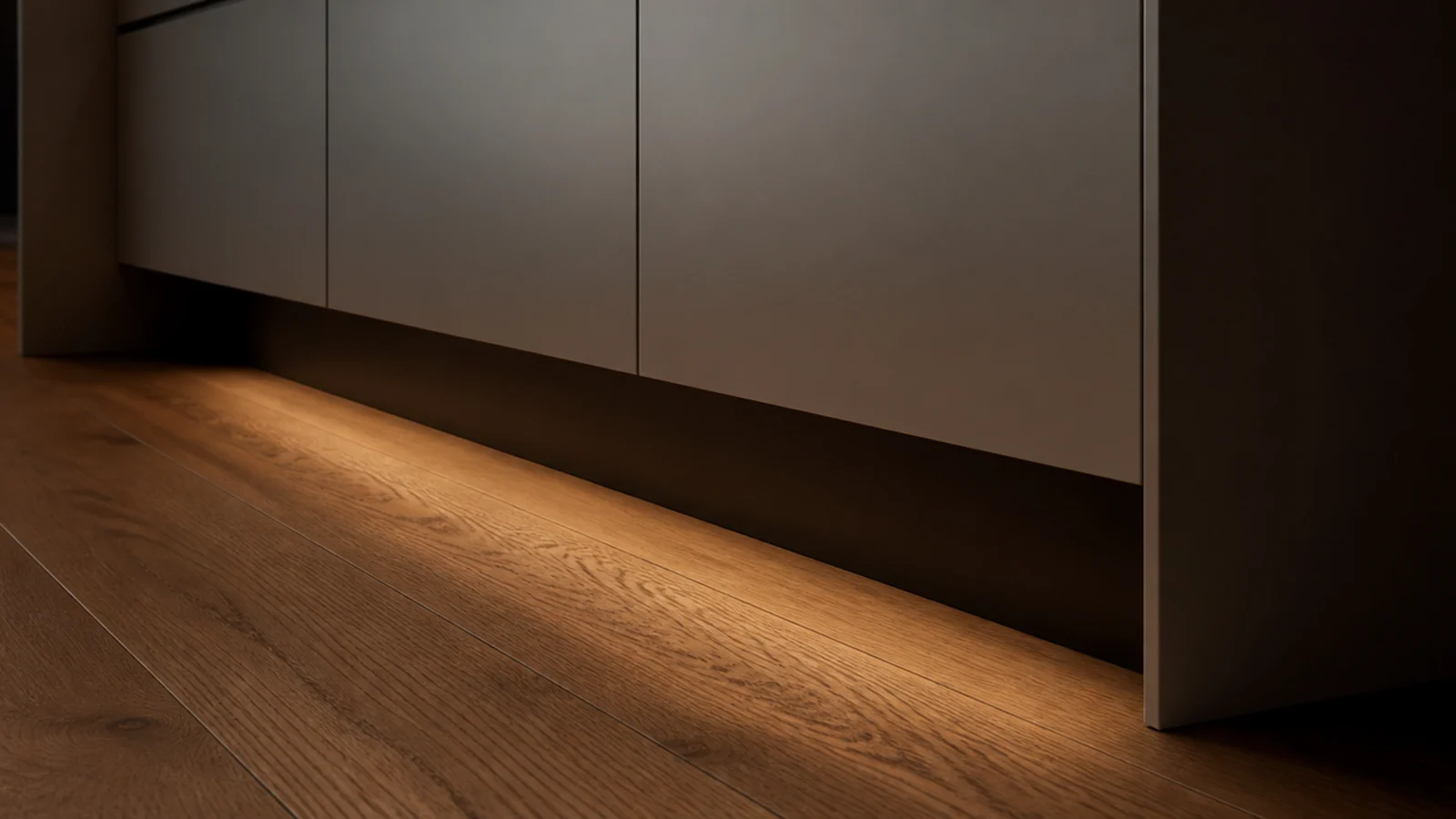modern built in cabinet floating above the floor with a dark recess beneath