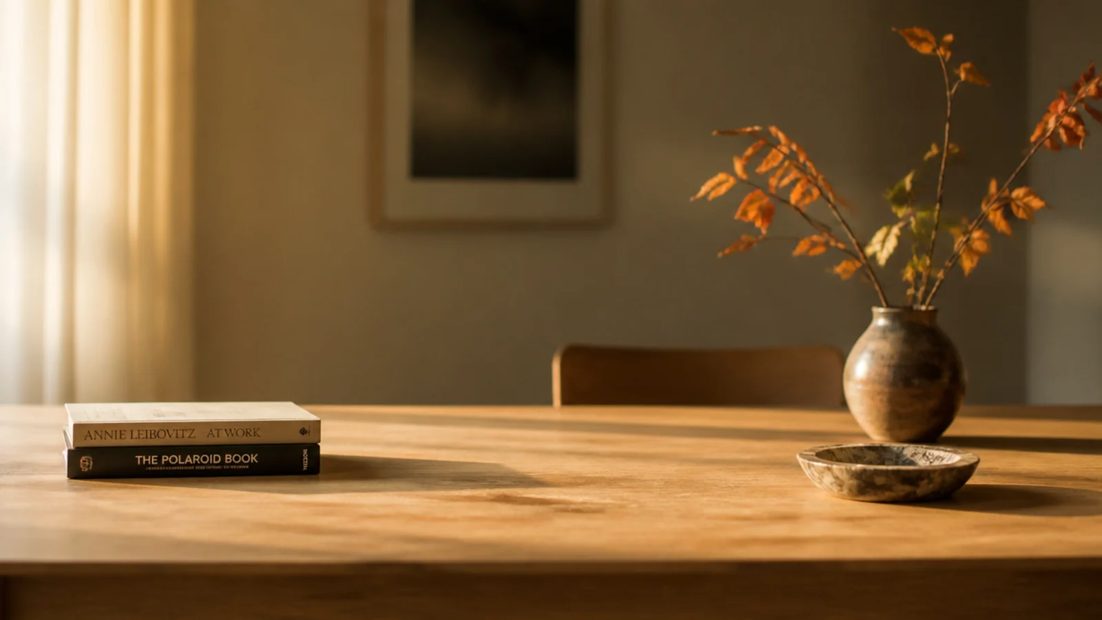 three seasonal objects arranged loosely across a bare timber table